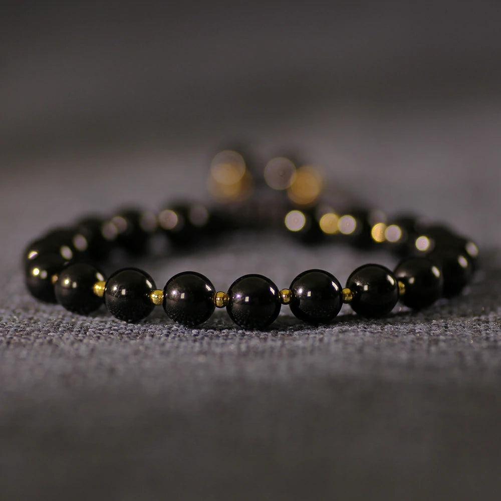Obsidian Bracelet with Gold Accent Beads – Stylish Contrast