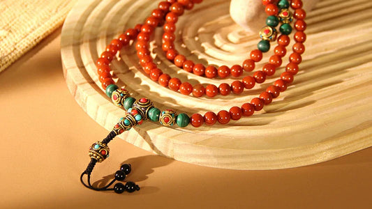 108 deep red Nanhong agate beads hand-strung into a traditional Buddhist mala, used for meditation and mantra counting.