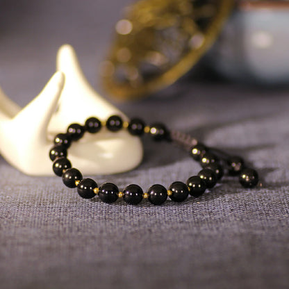 Obsidian Bracelet with Gold Accent Beads – Stylish Contrast