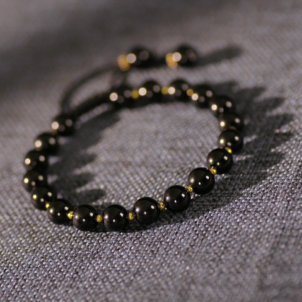 Obsidian Bracelet with Gold Accent Beads – Stylish Contrast