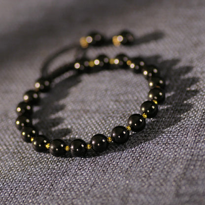 Obsidian Bracelet with Gold Accent Beads – Stylish Contrast
