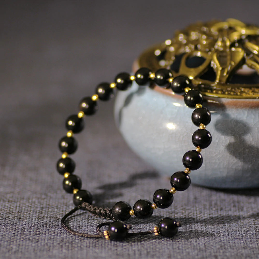 Obsidian Bracelet with Gold Accent Beads – Stylish Contrast