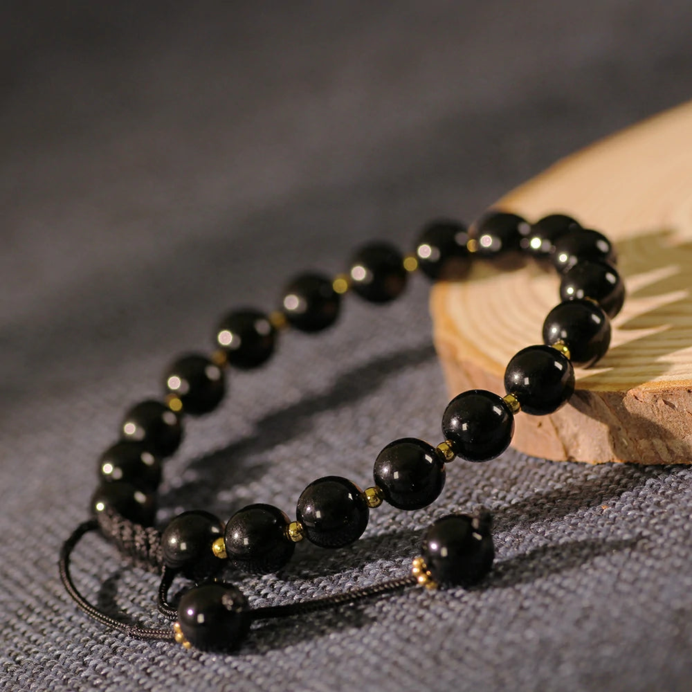 Obsidian Bracelet with Gold Accent Beads – Stylish Contrast