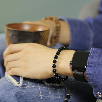 Obsidian Bracelet with Gold Accent Beads – Stylish Contrast